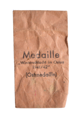 A 1941 - 42 EAST MEDAL marked 65 with paper bag maker Klein & Quenzer, Idar-Oberstein.