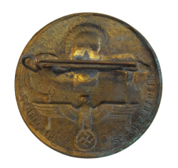 A 1934 National Day of Labour Badge maker marked.