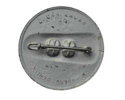 A 1934 National Day of Labour Badge maker marked.