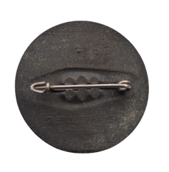 A 1934 National Day of Labour Badge maker marked.