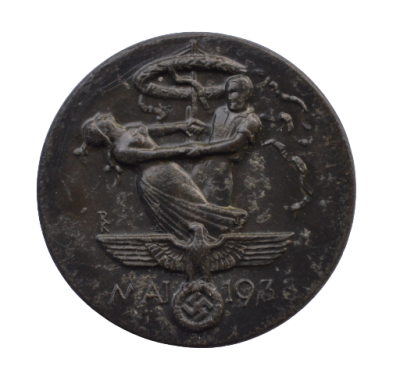 A 1934 National Day of Labour Badge maker marked.