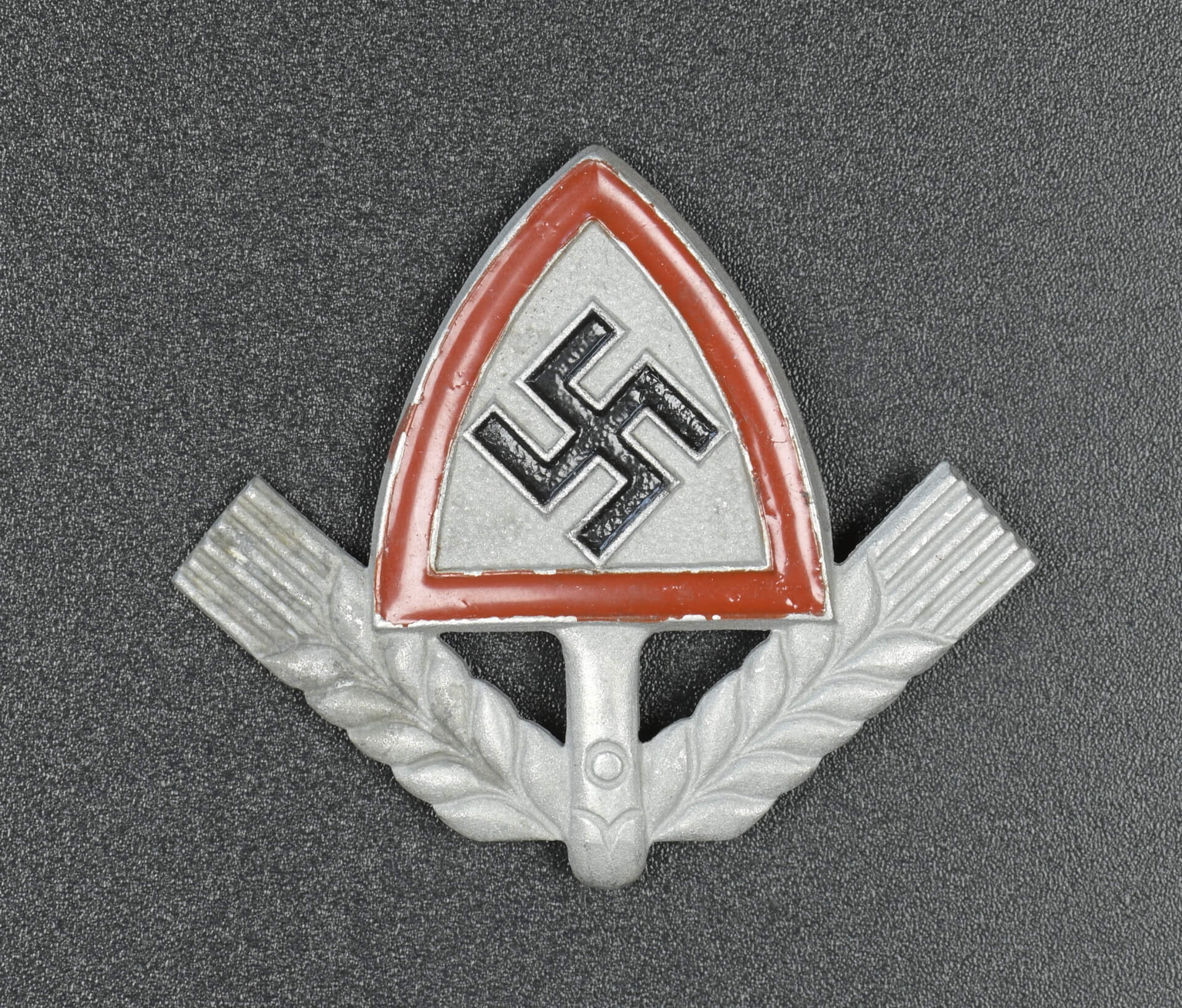 A RAD (National Labour Service) Cap Badge marked H. W. 38 GES. GESCH ...