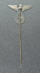 An NSDAP eagle stickpin marked GES.GESCH.
