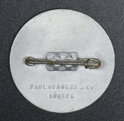 A 1938 National Day of Labour Badge maker marked Paul Schultze & Co..