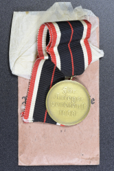 A War Merit Medal In Its Original Paper Packet Of Issue By Gottlieb Keck & Sohn, Pforzheim.