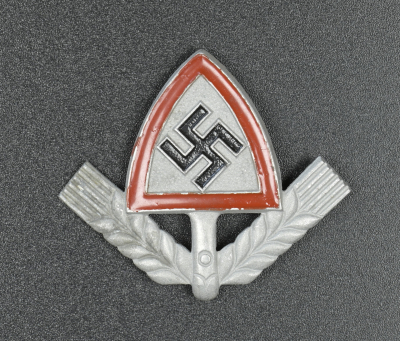 A RAD (National Labour Service) Cap Badge marked H. W. 38 GES. GESCH.